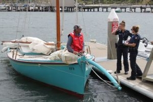 Sailor saves fishos from upturned tinny