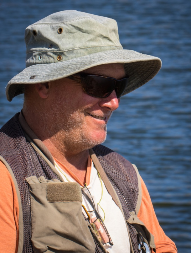 Chris Cleaver with his recently caught and released hybrid cod he likes to call a Murrout (cross between a Murray and trout cod).